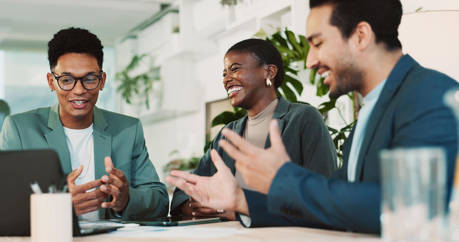 Laughing, teamwork and business people with laptop in office, financial planning and investment. Collaboration, employees and advisor in accounting firm for corporate performance, feedback or digital